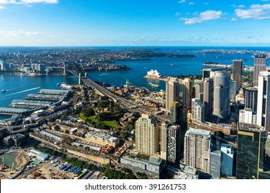 Aerial Photo Of Sydney CBD With Skyline And Harbour Bridge. Sydney Iconic Harbour Bridge And CBD Office Buildings. Bird's Eye View From Above On Sydney CBD And Sydney Harbour