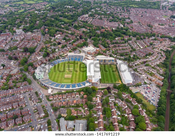 Aerial photo of  the. Emerald Headingley Stadium  and\
also of a typical town in the UK showing rows of houses, paths\
& roads, taken over Headingley in Leeds, which is in West\
Yorkshire in the UK.