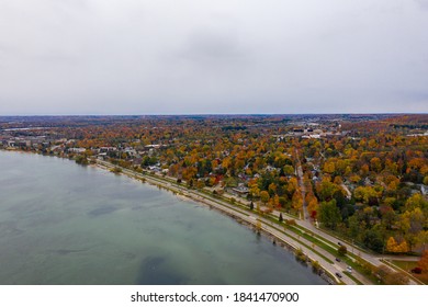 Aerial Photo Of Traverse City Michigan During The Fall. Autumn Colors Fill The Trees Creating A Beautiful, Colorful Landscape. 