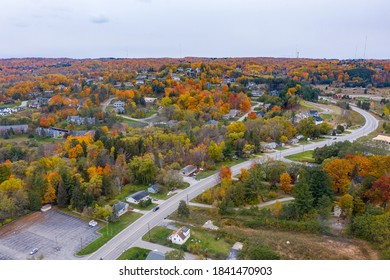 Aerial Photo Of Traverse City Michigan During The Fall. Autumn Colors Fill The Trees Creating A Beautiful, Colorful Landscape. 