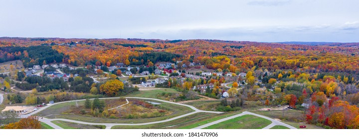 Aerial Photo Of Traverse City Michigan During The Fall. Autumn Colors Fill The Trees Creating A Beautiful, Colorful Landscape. 