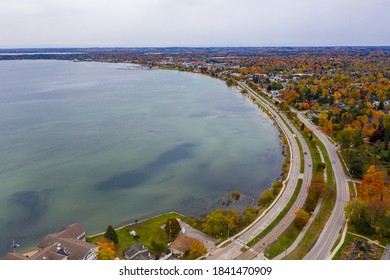 Aerial photo of Traverse City Michigan during the fall. Autumn colors fill the trees creating a beautiful, colorful landscape.  - Shutterstock ID 1841470909