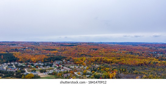 Aerial Photo Of Traverse City Michigan During The Fall. Autumn Colors Fill The Trees Creating A Beautiful, Colorful Landscape. 