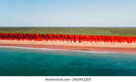 Aerial Photo of turquoise ocean water and red rock cliffs, James Price Point, Kimberley Region, Broome Western Australia - Powered by Shutterstock