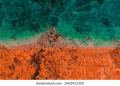 Aerial Photo of turquoise ocean water and red rock cliffs, James Price Point, Kimberley Region, Broome Western Australia - Powered by Shutterstock