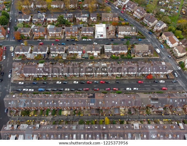 Aerial photo of a typical town in\
the UK showing rows of houses, paths & roads, taken over\
Headingley in Leeds, which is in West Yorkshire in the\
UK.
