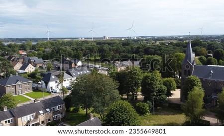 Aerial photo view of small village with a church in Belgium.