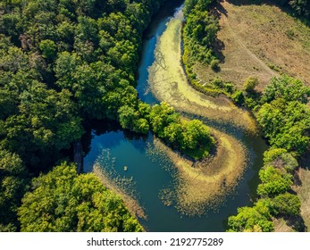 Aerial photograph of a drone flight over the Marghitas Lake.  Photo taken on 15th of August 2022, near Anina city, Caras-Severin County, Romania. - Shutterstock ID 2192775289