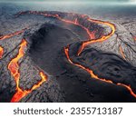 Aerial photograph of lava river. The view of Majestic Volcanic Mountains and Flowing Lava