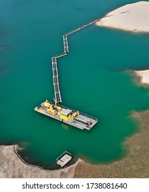 Aerial Photograph Of A Suction Excavator In A Wet Mining Operation With Connected Pipeline