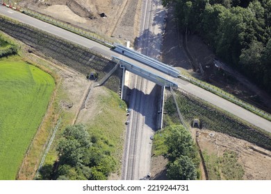 An Aerial Photograph Taken From A Helicopter Of A Large Railway Reinstatement Project In The UK. Rebuilding A Historic Train Route For New Passenger Services. A Pedestrian Foot Bridge.