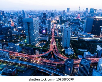 Aerial Photograph Of Urban Area And Curved Highway.tokyo Tower.