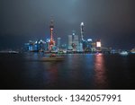 Aerial photography cityscape viewed across the Huangpu River and city landmark buildings background at Shanghai Skyline of panorama of night scene