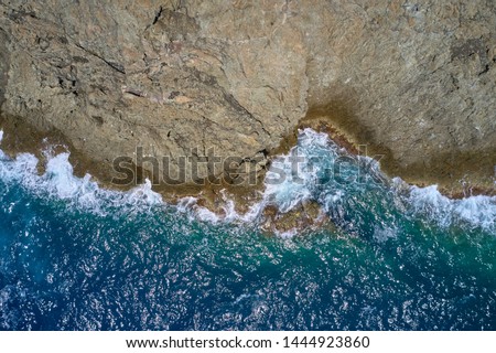 Similar – Aerial Drone View Of Dramatic Ocean Waves Crushing On Rocky Landscape