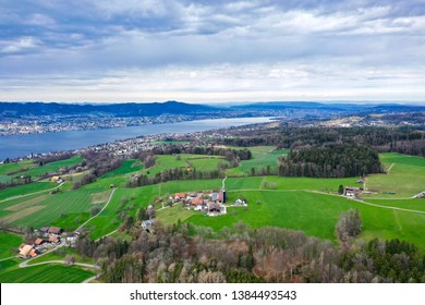 Aerial Photography from Herrliberg towards the town of Zurich with views on the lake of Zurich, forests, fields of the farmers, towns of Erlenbach, Herrliberg, Horgen, Oberrieden, Rueschlikon, Zurich
