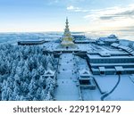 Aerial photography of snow covered Mount Emei in winter, the golden summit of Mount Emei in Sichuan(Huazang Temple), a famous Buddhist mountain in China.(Translation: Samantabhadra of Buddhism)