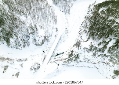 Aerial Photography Winter Landscape Bridge Over The River, Rocky Terrain And Forest. Winter Landscape Top View