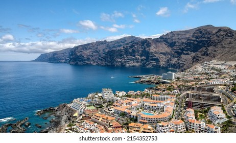 Aerial photos of the coast and tourist area of Puerto Santiago and Los Gigantes, Tenerife, Canary Islands. Drone photo. - Shutterstock ID 2154352753