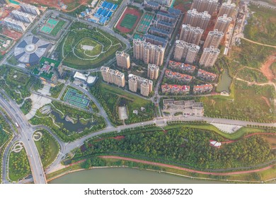 Aerial Photos Of Industrial And Residential Areas Near Shenzhen, China. Urban Buildings Surrounded By Greenery.