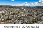 Aerial Photos over a community in Vallejo, California with houses, streets, cars and parks