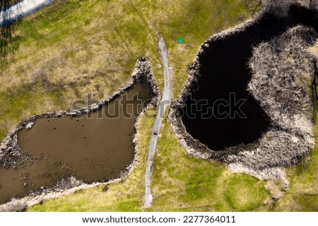 Aerial phytography view of a golf course in Boston. Nahant golf course with wetlands around.