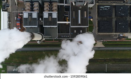 Aerial satellite view of coal fired power station is a thermal plant which burns a fossil fuel to produce electricity by converting heat of combustion into mechanical energy