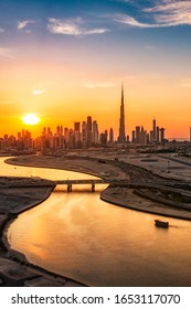 Aerial scene of sunset over the city of Dubai. High buildings. Luxury travel destination in the middle east. 