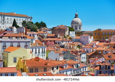 Aerial scenic view of central Lisbon, Portugal with red tile roofs and Church of Santa Engracia, the National Pantheon