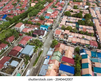 Aerial Of Serveral Subdivisions Of Rowhouses For Low To Middle Income Families. At Naic, Cavite, Philippines.