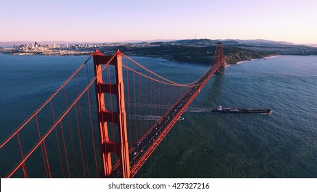 aerial sf golden gate right up forward over sunset
