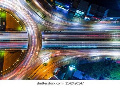 Aerial shoot top view circle road Traffic in city at night, bangkok , thailand.