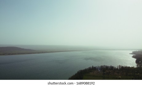 Aerial Shot Above A Lake With Polution In The Air