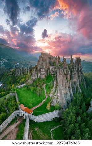 Aerial shot of Beautiful landscape with bizarre rock formations. Stone stairs leading to the amazing rock formations and walls of a medieval fortress in Belogradchik, northwest Bulgaria.