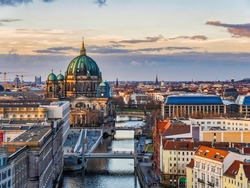 Aerial Shot Of Berlin Cathedral, Spree Canal And Historic Buildings During Asunset, Germany
