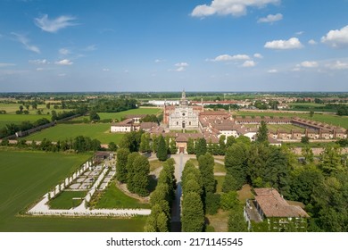 Aerial shot of the Certosa di Pavia at sunny day, built in the late fourteenth century, courts and the cloister of the monastery and shrine in the province of Pavia, Lombardia, Italy - Shutterstock ID 2171145545