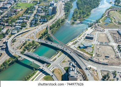 Aerial Shot Of A City Highway That Runs Across A River. Bow River, Calgary, Alberta.