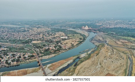 An Aerial Shot Of Densely-populated Agra City And Taj-Mahal On The Background