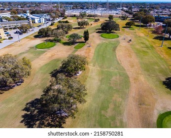 An Aerial Shot Of A Golf Field In Florida On A Sunny Day