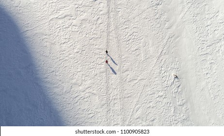 Aerial Shot Of Hiking People From Above Walking On A Snow Path Hiking Paradise In Switzerland, Seealpsee