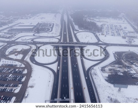 An aerial shot of interchange roads in Kaunas Lithuania covered with snow in winter