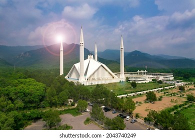 Aerial shot of Islamabad, the capital city of Pakistan showing the landmark Shah Faisal Mosque and the lush green mountains of Margala Hills - Shutterstock ID 2043740249
