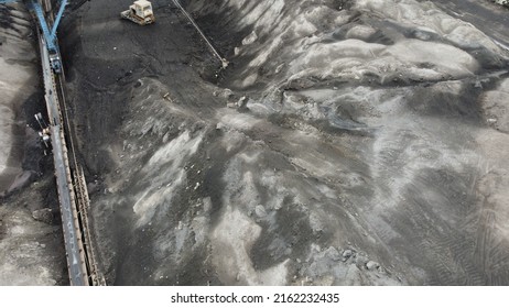 Aerial Shot Of A Large Ash Dump Created By Burning A Large Amount Of Coal. Located Near The City Center