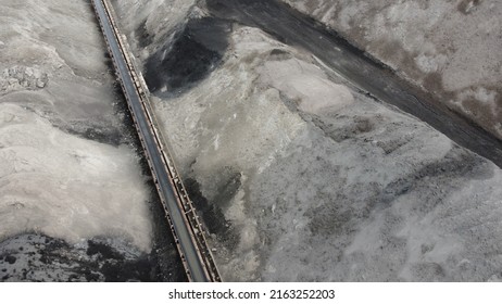 Aerial Shot Of A Large Ash Dump Created By Burning A Large Amount Of Coal. Located Near The City Center