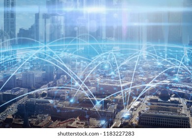 Aerial shot of a large metropolitan city where you can see graphics that connect all the people of the world thanks to the internet. Concept of: speed, future, connection.