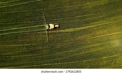 An Aerial Shot Of A Lawn Mowing Car In A Grassland