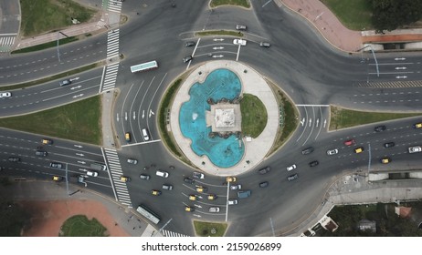 Aerial shot made with drone of a roundabout in the streets of the city of Buenos Aires with cars circulating