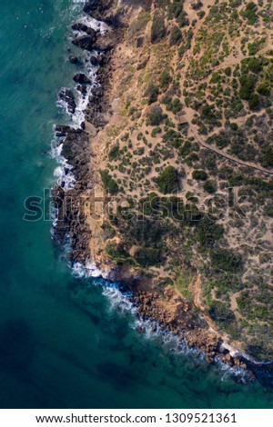 Similar – Aerial Drone View Of Dramatic Ocean Waves Crushing On Rocky Landscape