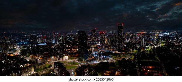 Aerial Shot Of Manchester, UK At Night. Night Skyscrapers Standing In The City Lights.