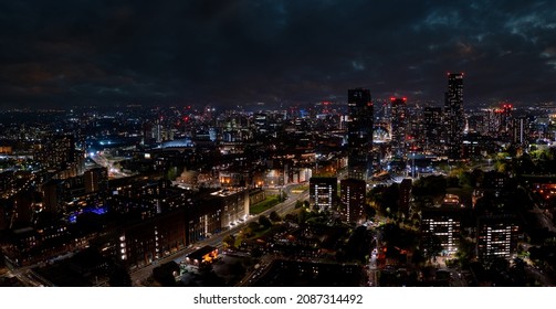 Aerial Shot Of Manchester, UK At Night. Night Skyscrapers Standing In The City Lights.