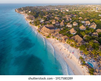 Aerial Shot On Zanzibar A Beautiful Sunset With People Walking On The Nungwi Beach In Zanzibar In Tanzania